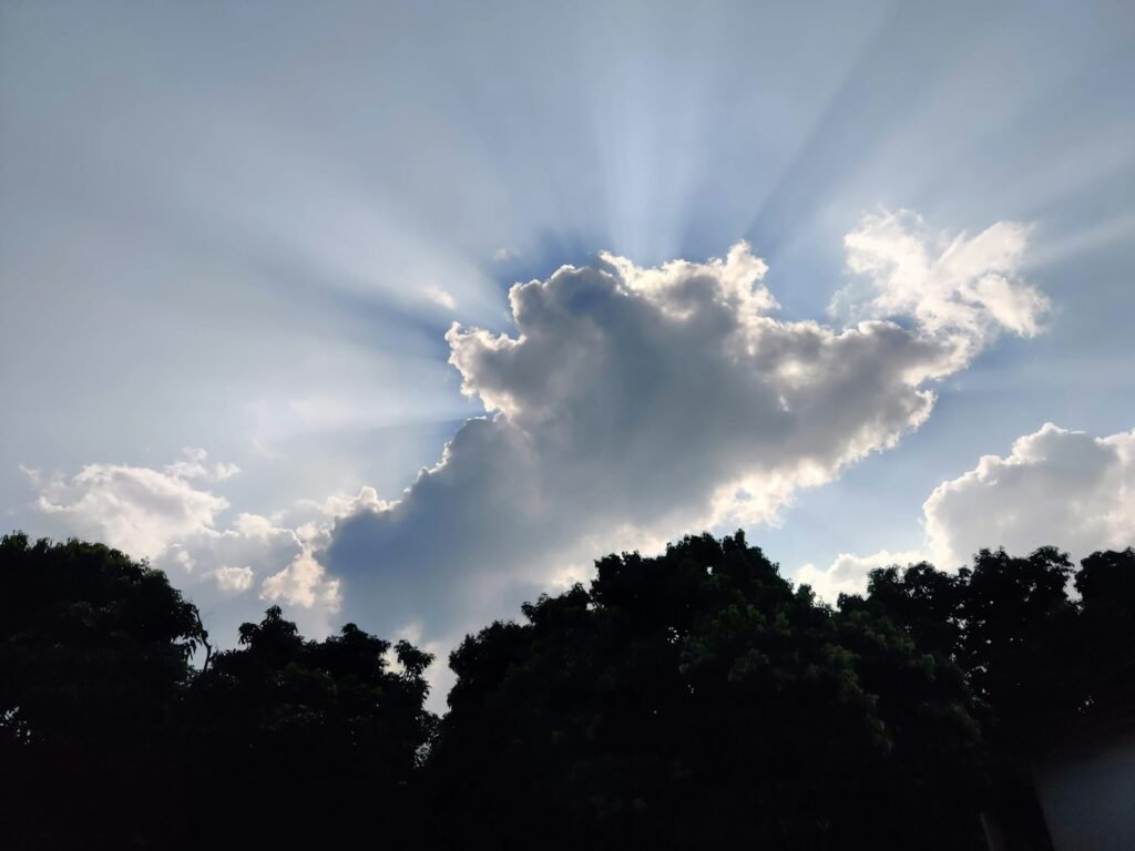 the sun is shining through the clouds in the sky