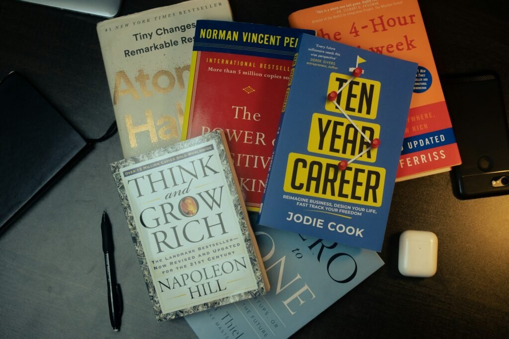 a pile of books sitting on top of a table Think & Grow Faith