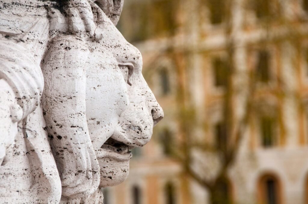 a close up of a statue of two lions. Power of Authority